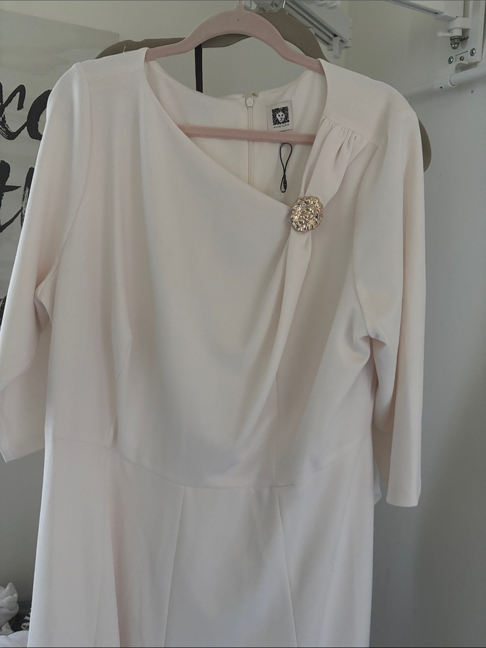 Elegant Cream Women's Dress with Decorative Brooch
